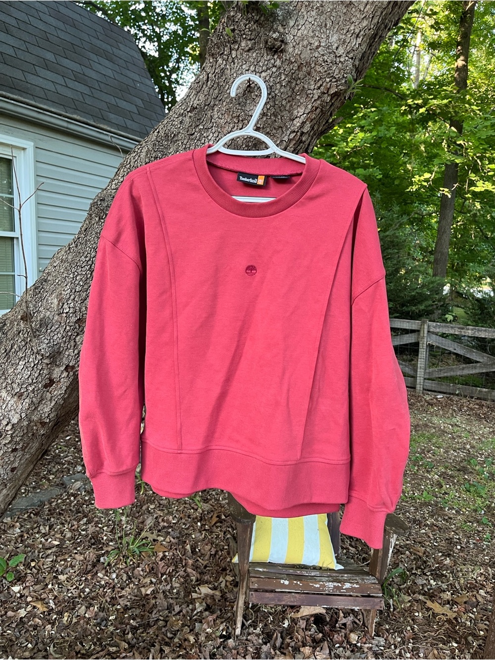 Light rose sweatshirt by Timberland. M. Side slits for style .